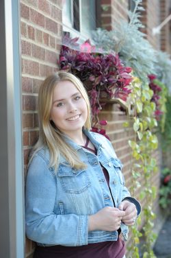 Shelby posing for her headshot.